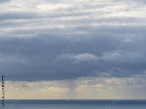 Layered evening clouds over Tasman sea coast