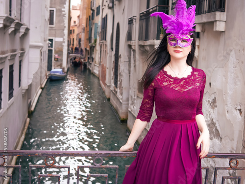 Brunette woman in carnival mask with feathers  in Venice  © Наталья Добровольска