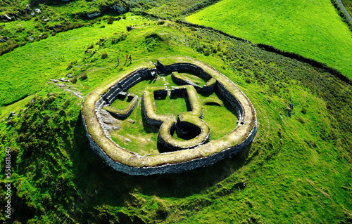 Leacanabuaile 9th century AD Celtic stone ringfort fort defended farmstead aka cashel near Cahersiveen, Iveragh peninsula, County Kerry, Ireland photo