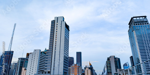 Horizontal banner of large city buildings with the sky.