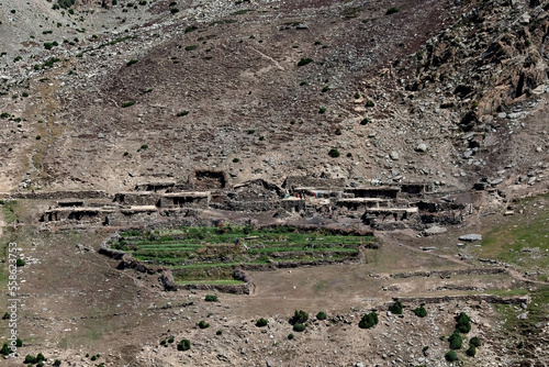 Traditional village houses on the hill in Northern Pakistan photo