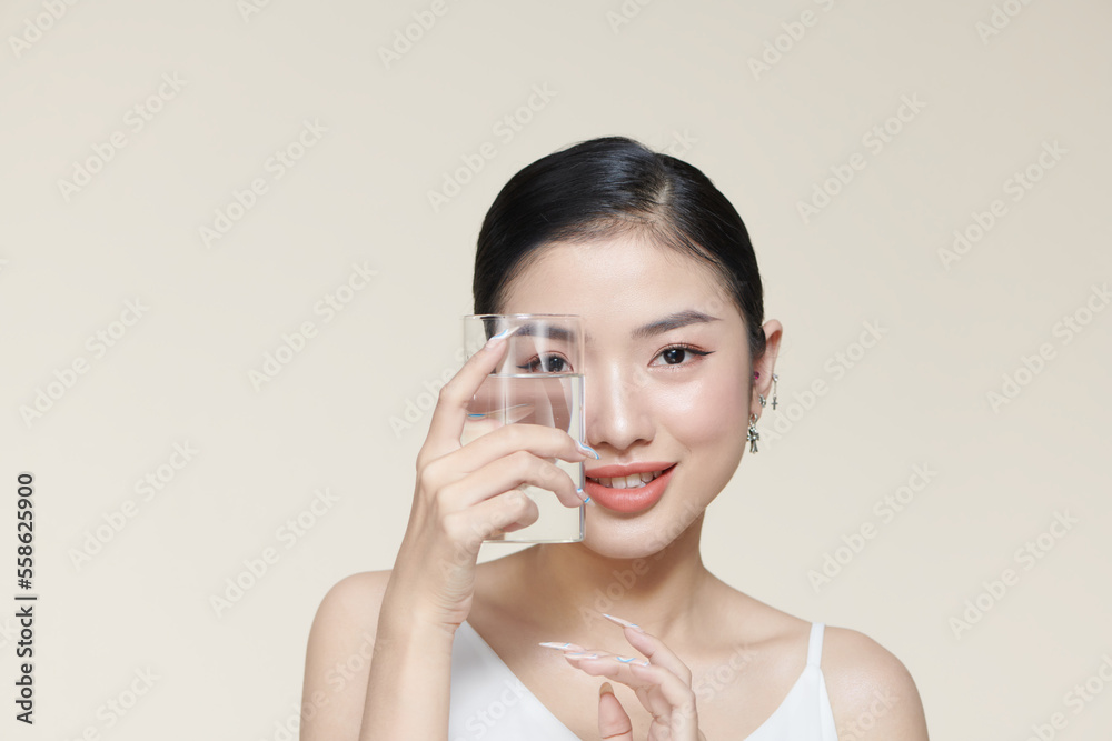 Young woman with glass of mineral water Young woman with glass of mineral water