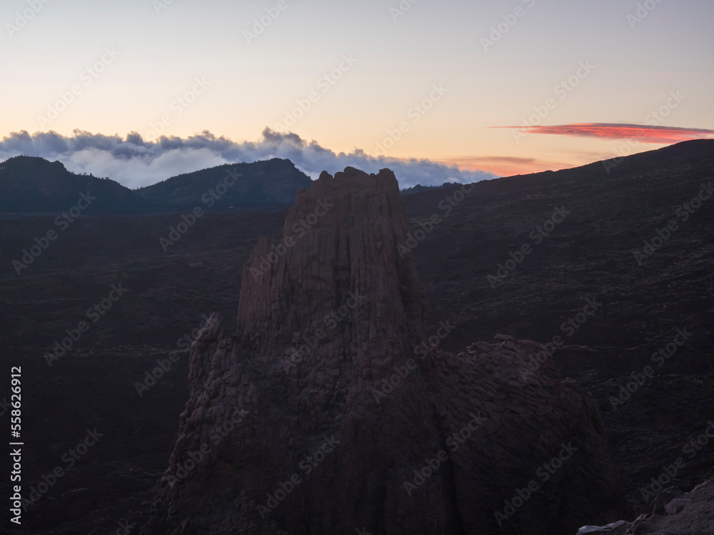 Red sunset light at Roques de Garcia with La Catedral volcanic rock formation at El Teide national park, Tenerife Canary islands, Spain.