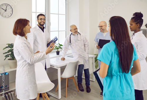 Tablou canvas Diverse group of happy doctors meeting in the staff room