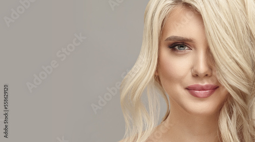 Blonde woman with elegant hair in studio