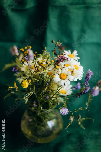 Bouquet of wildflowers in vase. Camomile flowers