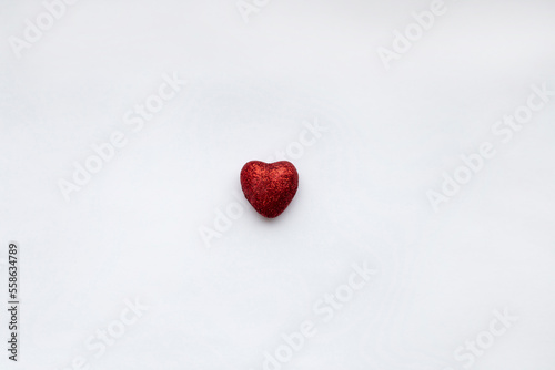 The 14th of February is Valentine s Day one little red heart on white background 