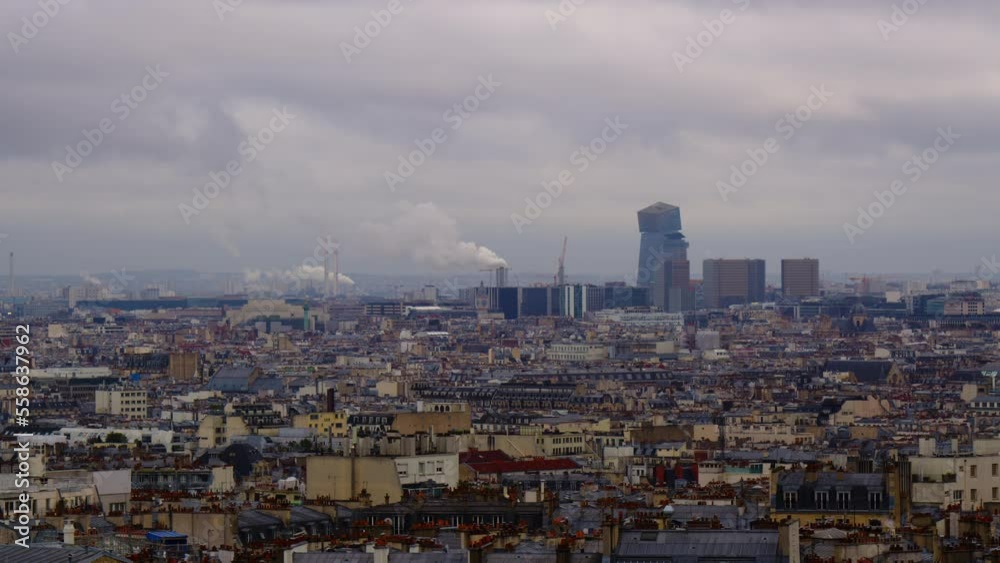 View of the city from the highest point in Paris. Roofs of Parisian houses against a cloudy sky. Sights of Paris at sunset. Timelapse of passing clouds over the roofs of old houses View of the city from the highest point in Paris. Roofs of Parisian houses against a cloudy sky. Sights of Paris at sunset. Timelapse of passing clouds over the roofs of old houses