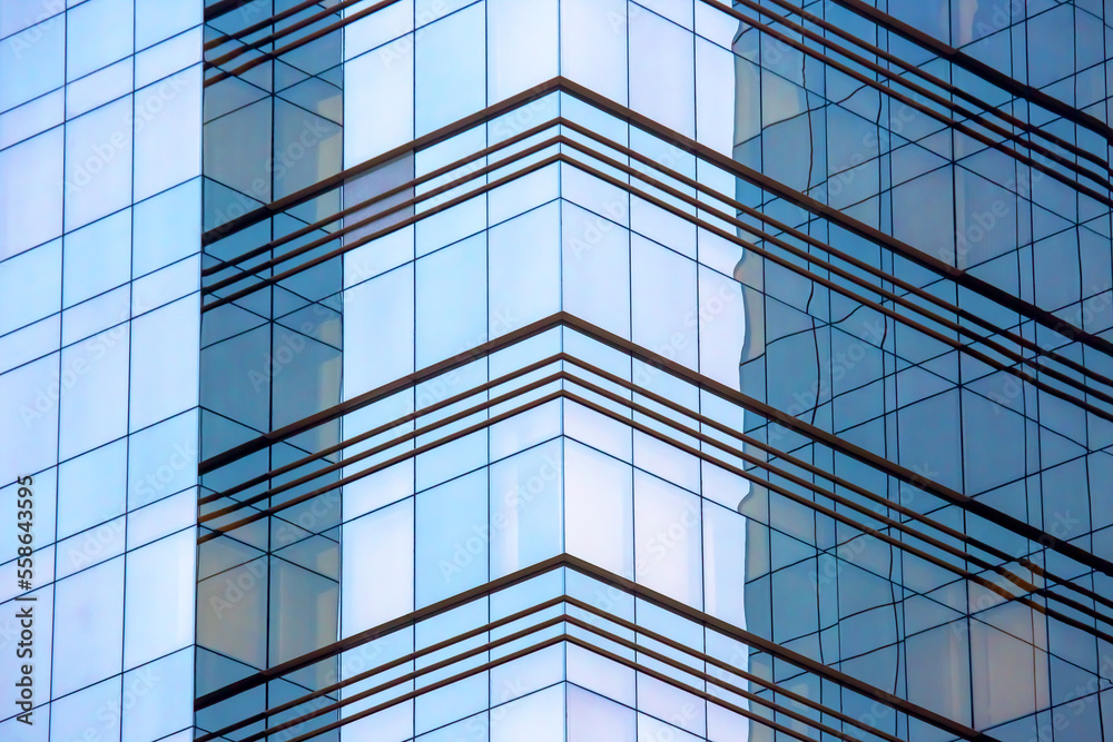 glass facade of a large modern building glass facade of a large modern building