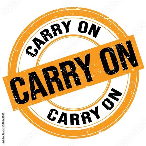 Принти на полотні CARRY ON text written on orange-black round stamp sign