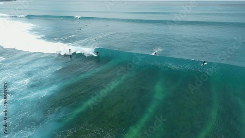 Aerial view with surfing on wave. Waves with surfers in ocean