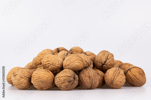 Walnut in shell isolated on white background. Energy boost for the day. The concept of proper nutrition. Tasty breakfast.