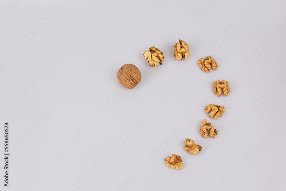 Half a walnut isolate. Peeled walnut on white. Walnut top view. Set with clipping path. Valentine's Day. Half a walnut isolate. Peeled walnut on white. Walnut top view. Set with clipping path. Valentine's Day.