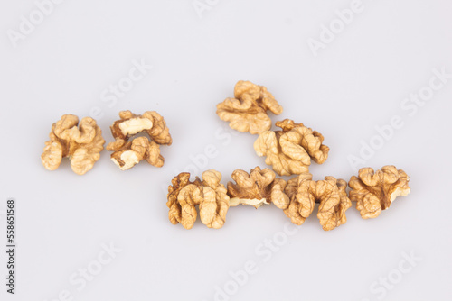 Half a walnut isolate. Peeled walnut on white. Walnut top view. Set with clipping path. Full depth of field.