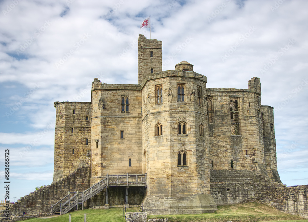 warkworth, uk.  castle with blue sky in the background