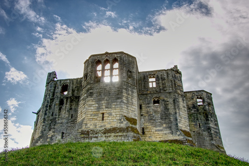 warkworth castle with blue sky in the background