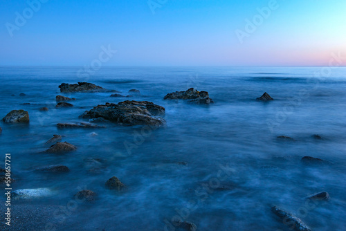 stony shore in the sea water