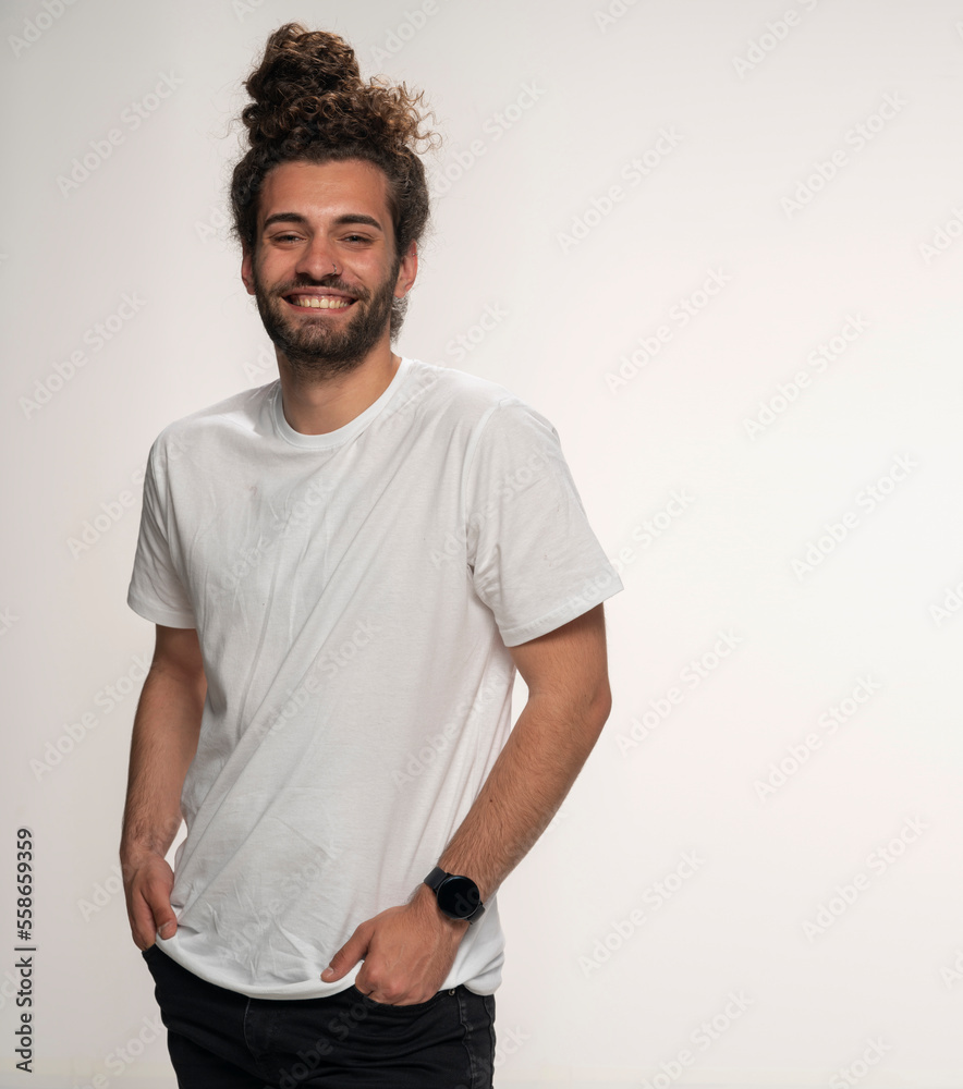 Portrait of man with hair bun smiling, isolated on white background. Portrait of man with hair bun smiling, isolated on white background.