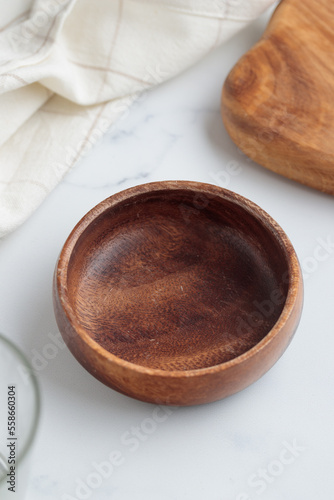 Empty tableware - wooden plate  a bowl and a cup on white table as a background for a dish foodbackground
