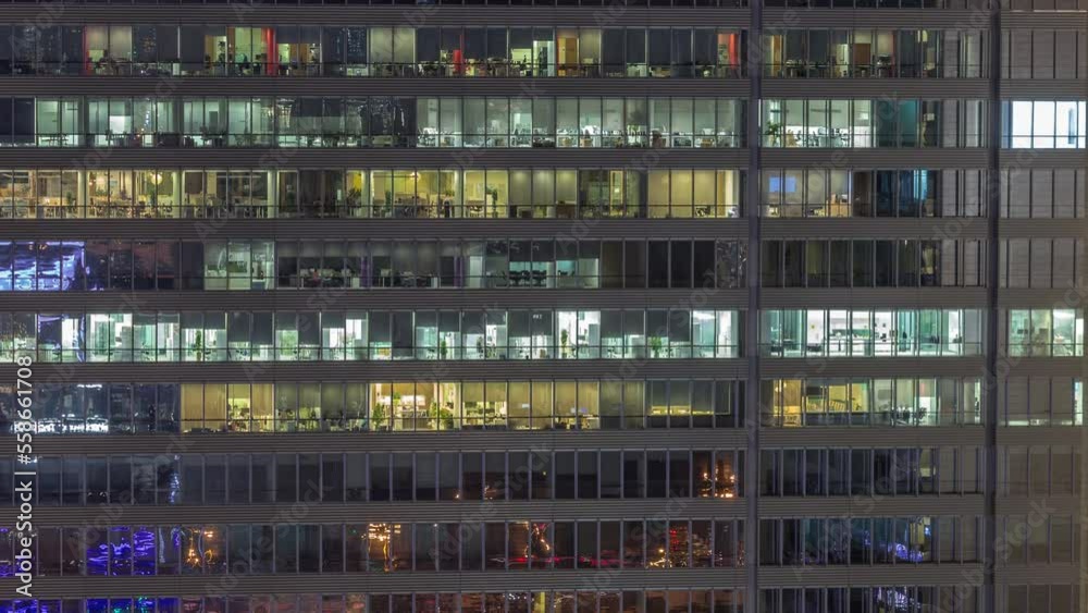 Windows of office buildings at night timelapse, the light from the windows of skyscrapers. Evening landscape of the city with glowing working space Windows of office buildings at night timelapse, the light from the windows of skyscrapers. Evening landscape of the city with glowing working space