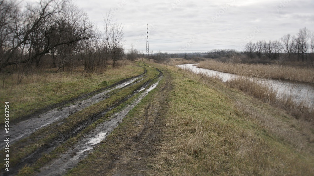 A dirt road parallel to the river