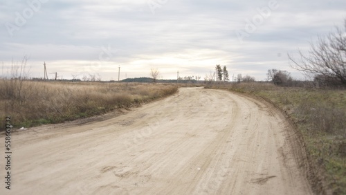 A wide, flat, sandy road through the village © Alexander Volokha