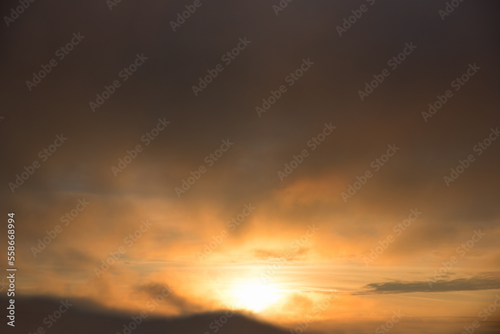 dark sky background with sinking sun, yellow and gray color