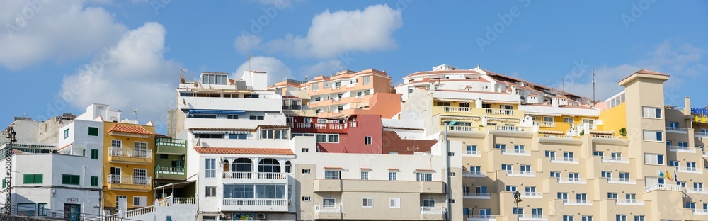Closeup residential buildings along Sirena street, Puerto de Santiago, Tenerife.
