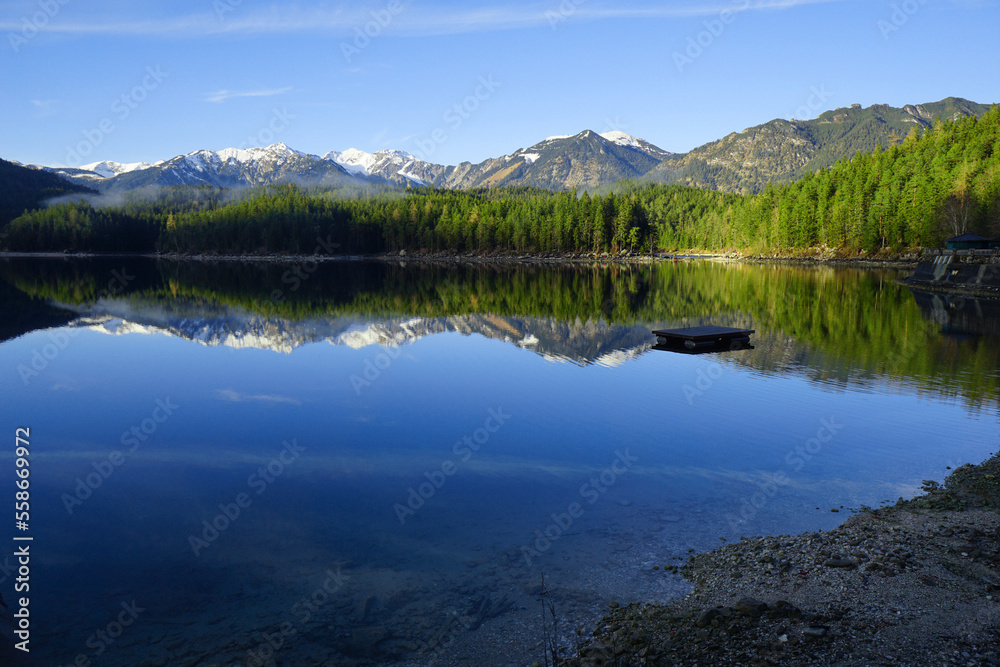 Beautiful view of Lake Eibsee with reflection in the mountains.