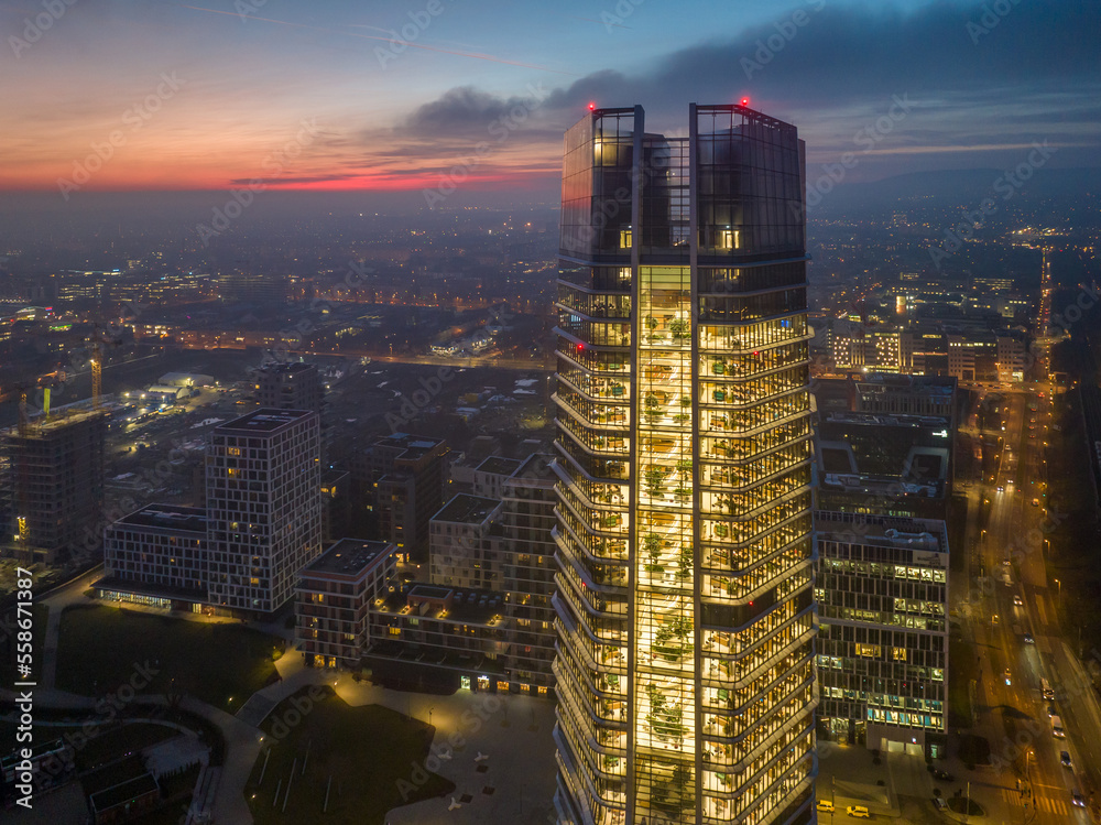 Fototapeta premium Hungary - Budapest landscape with the amazing highest skyscraper (MOL HQ) from drone view at night