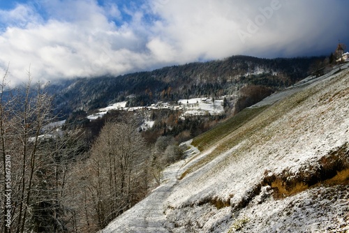 View of Jamnik village bellow Jelovica plateau in Gorenjska, Slovenia in winter