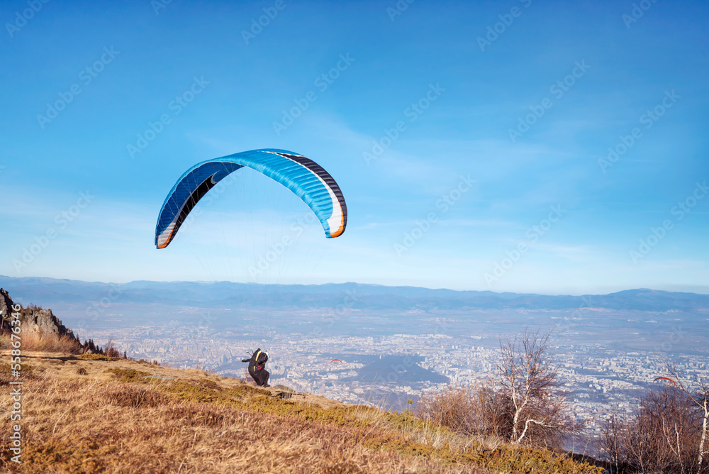 Paraglider at the start above the city of Sofia ,Bulgaria Paraglider at the start above the city of Sofia ,Bulgaria