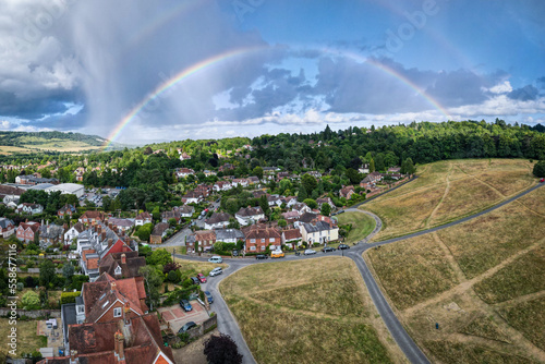 UK- Rainbow over houses in Dorking, Surrey- a lovely market town set in the Surrey Hills photo