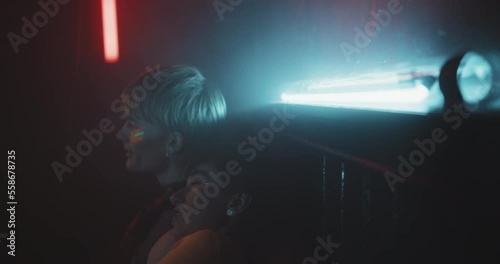 Young LGBT couple taking a break sitting at a party photo