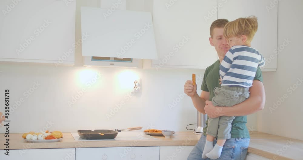 Father and son talking and eating Father and son talking and eating