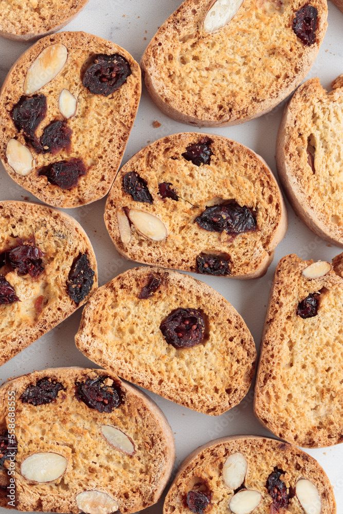 Biscotti cantucci cookies with almond and cranberry on white background top view Biscotti cantucci cookies with almond and cranberry on white background top view