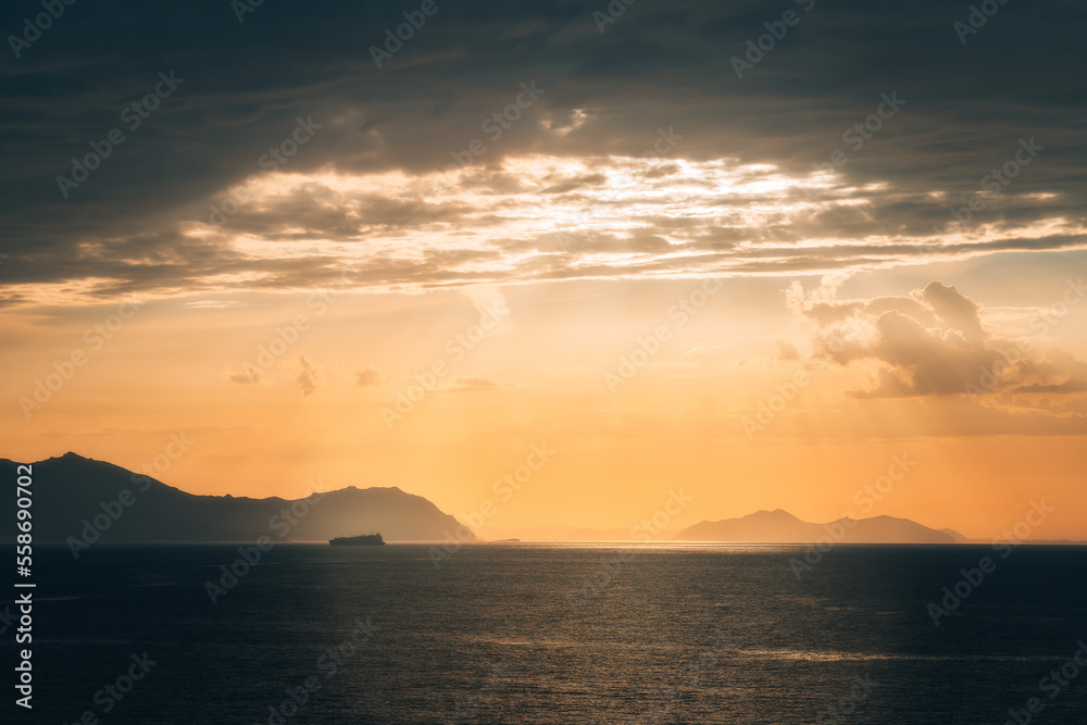 Sunset over the sea with a Cruise Ship on sea