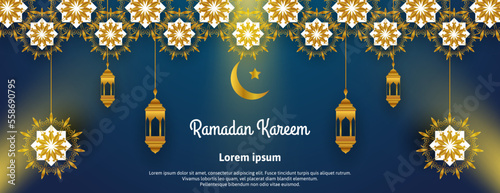 golden ramadan kareem banner design with lantern, light and mandala on blue background photo