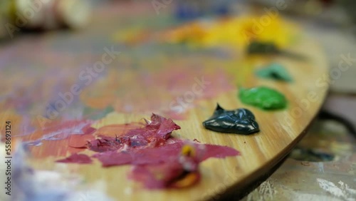 Colorful paints from tubes on palette ready for painnting