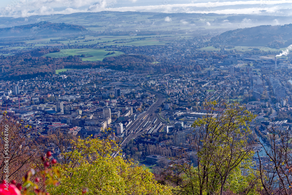 Aerial view from village Magglingen Macolin, Canton Bern, over City of Biel Bienne and lake with Aaare River on a blue cloudy autumn day. Photo taken November 10th, 2022, Magglingen, Switzerland.
