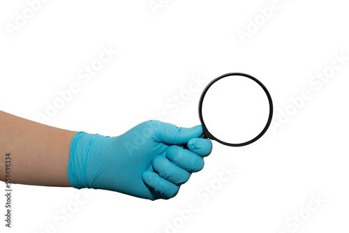 person with blue gloves holds magnify glass isolated in white background with clipping path