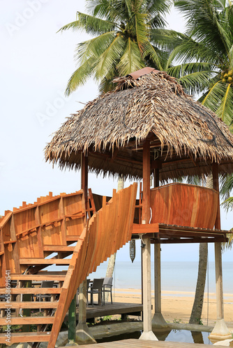 Fototapeta Naklejka Na Ścianę i Meble -  Wood Pavilion or straw hut near sand beach.