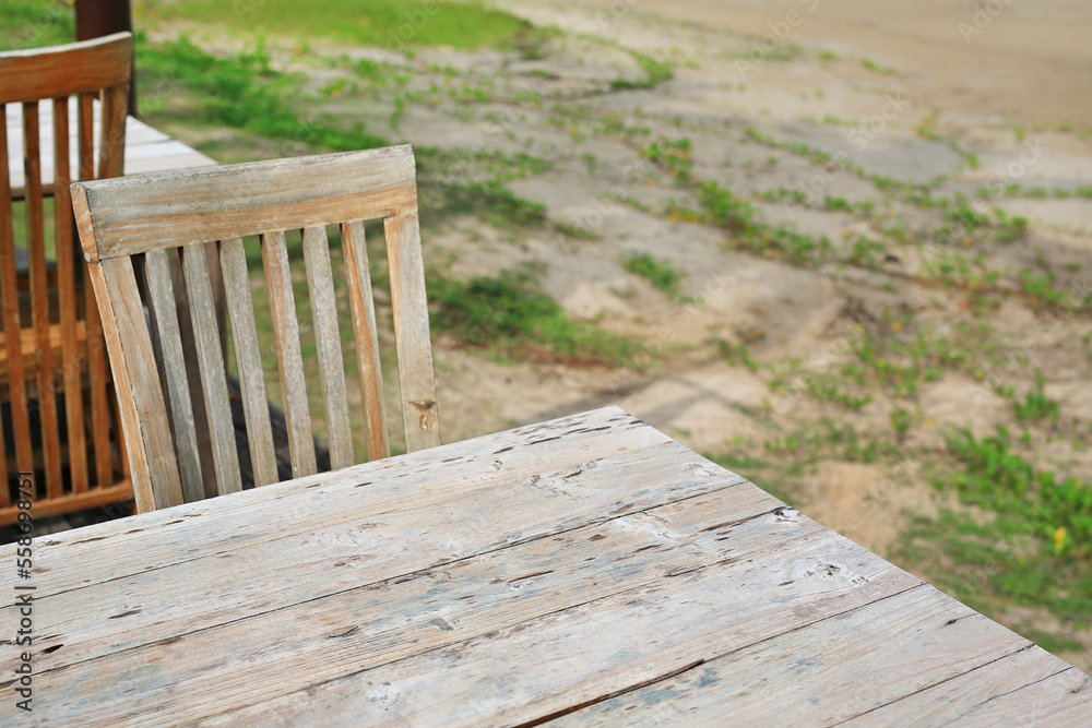 Empty wood table and chairs at restaurants near the beach. Empty wood table and chairs at restaurants near the beach.
