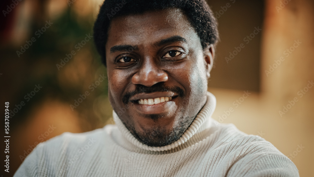 Close-up Portrait of Handsome Black Man with Trimmed Beard, Wearing Stylish White Turtleneck, Smiling and Looking at the Camera. Confident Male Startup CEO Celebrating his Achievement Close-up Portrait of Handsome Black Man with Trimmed Beard, Wearing Stylish White Turtleneck, Smiling and Looking at the Camera. Confident Male Startup CEO Celebrating his Achievement