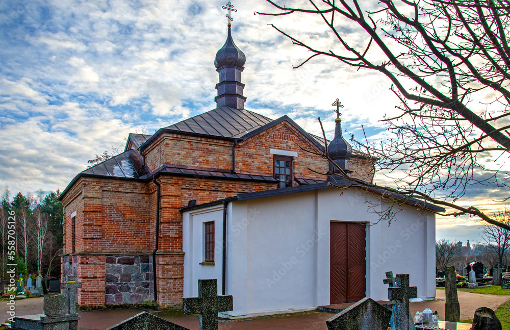 A wooden belfry and an eclectic style Orthodox cemetery chapel of the Transfiguration of the Lord built in 1912 near the village of Klejniki in Podlasie, Poland.