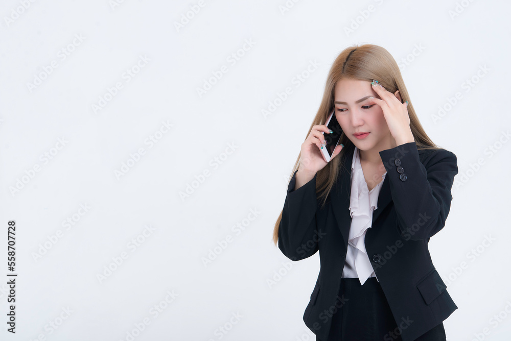 Asian business woman talk telephone about serious work on white background,Stress people concept Asian business woman talk telephone about serious work on white background,Stress people concept