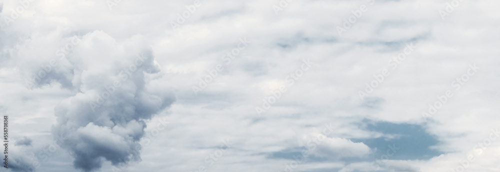 A whimsical cloud in the sky on a background of white clouds A whimsical cloud in the sky on a background of white clouds