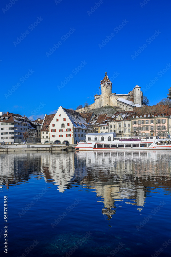 The Swiss old town Schaffhausen in winter, with the medieval castle Munot over the Rhine river. Munot is the landmark of this town.