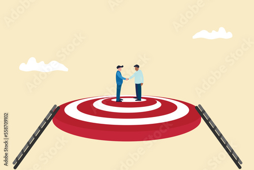 success businessmen finish deal and handshake on target. concept of Collaborate, cooperate or partnership and agreement to help business success, together or teamwork.