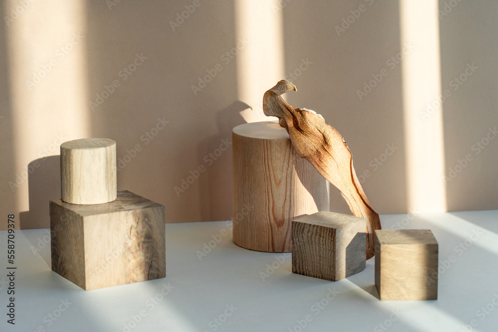 Composition empty podium material wood and dry flowers. Beautiful pastel background made of natural materials for the presentation of your product.